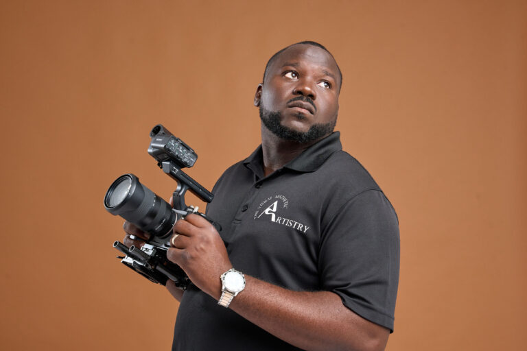 Allan Clare Jr. Holding a camera